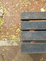 Negative Space, a copy space of the edge of a wooden chair that is starting to turn black. photo