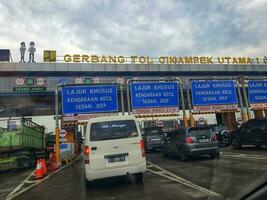 Cikampek, Indonesia in November 2022. The queue of cars that will enter the Cikampek Utama toll gate. photo