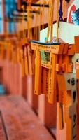 Kyoto, Japan in April 2019. Wish and prayer board or commonly called Ema. Ema are small wooden plaques, common in Japan, on which Shinto and Buddhist devotees write prayers photo