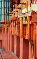 Kyoto, Japan in April 2019. Wish and prayer board or commonly called Ema. Ema are small wooden plaques, common in Japan, on which Shinto and Buddhist devotees write prayers photo