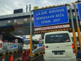 Cikampek, Indonesia in November 2022. The queue of cars that will enter the Cikampek Utama toll gate. photo