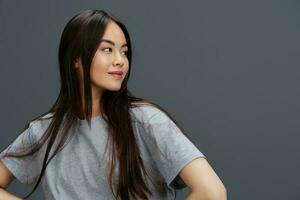 pretty woman in a t-shirt and jeans posing Youth style studio model photo