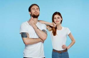 young couple in white t-shirt fashion modern style blue background photo
