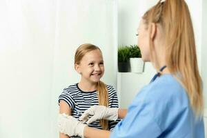 funny girl hospital next to the doctor injection treatment vaccine photo