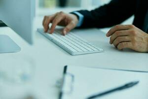 keyboard on desktop hands typing close up photo