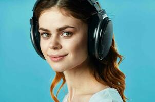 cheerful girl in a white t-shirt wearing headphones joystick technology game photo