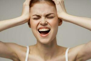 disgruntled woman headache health problems stress studio treatment photo