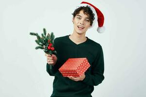 curly guy in a Santa hat gift holiday New Year photo