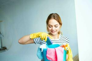 Cleaning lady in rubber gloves tools for washing home interior rendering services photo