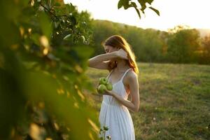 pretty woman in white dress outdoors trees rest freedom photo