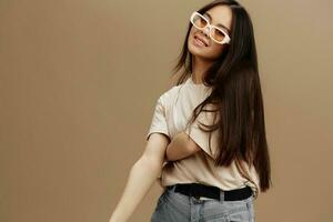 woman in a beige T-shirt with glasses posing clothing fashion studio model photo
