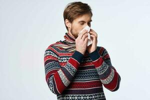 emotional man sweater health problems handkerchief flu infection studio photo