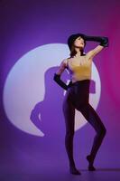 Beauty Fashion woman posing on stage spotlight silhouette disco purple background unaltered photo