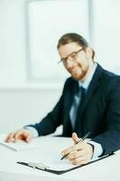 business man sitting at his desk computer office official photo