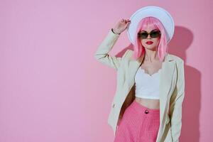Portrait of a charming lady attractive look white blazer pink wig pink background unaltered photo