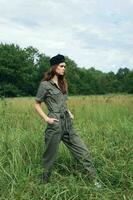 Woman on nature Walk across the field with my hands in the pockets photo