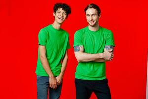 two friends in green t-shirts communication friendship positive photo