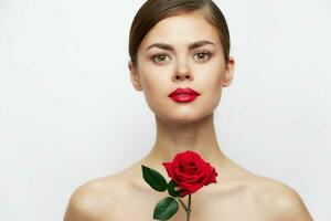 Lady with rose Looks ahead red lips, clear skin luxury light photo