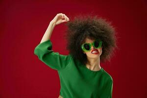 woman with afro hairstyle wearing glasses red lips posing photo