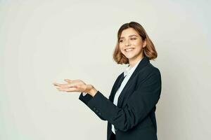 Business woman in suit gesturing with hands emotions work manager close-up photo