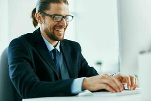 business man at his desk office typing on keyboard photo