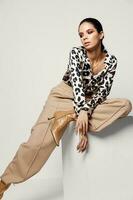 woman in fashion clothes bright makeup leopard shirt Studio photo