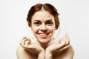 pretty woman with surprised facial expression naked shoulders cosmetics fashion photo