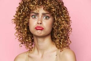Pretty woman curly hair Red lips sad facial expression close-up photo
