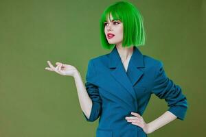 Pretty young female attractive look green wig blue jacket posing color background unaltered photo