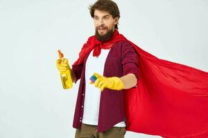 man with detergent in hands red raincoat professional service work photo