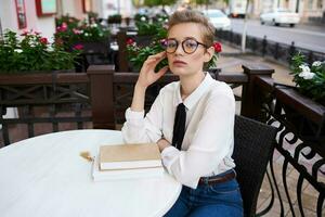 short haired woman on the street vacation in the city summer communication photo