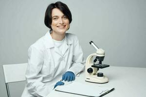 woman scientist laboratory microscope biotechnology photo