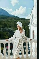 Portrait woman posing against the backdrop of mountains on the balcony architecture unaltered photo