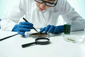cheerful female biologist in a white coat scientist laboratory photo