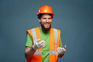 Emotional man on orange paint professional builders work photo