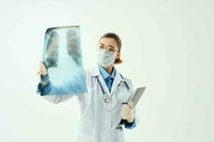 female doctor with x-ray in hands examination diagnostics hospital photo