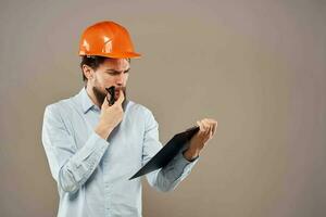 Business man in orange paint documents industry lifestyle beige background photo