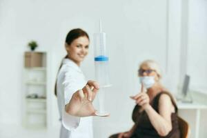 nurse and patient large syringe vaccine passport photo