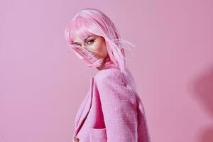 glamorous woman with pink wig posing luxury photo