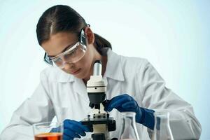 female doctor medicine laboratory microscope research photo