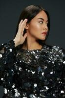 Asian woman on glittery outfit photo