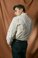 handsome man in shirt beige fabric self-confidence attractive model style photo