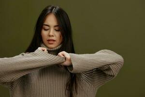 Brunette in a sweater posing smile clothing fashion isolated background photo