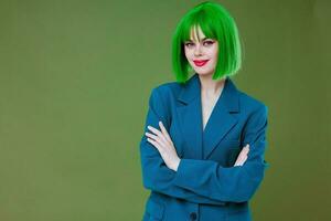 Beautiful fashionable girl Glamor green wig red lips blue jacket color background unaltered photo