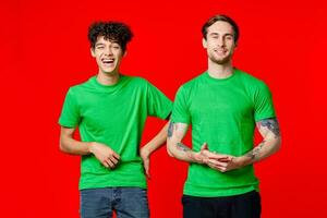 two friends green t-shirts emotions communication joy photo