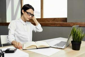 female manager in the office with glasses self-confidence isolated background photo