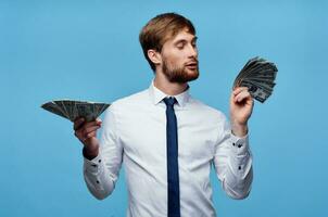 man in shirt with tie finance money self confidence blue background photo