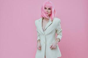 Portrait of a charming lady in a suit makeup pink hair posing color background unaltered photo
