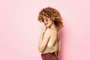 Model red pants Attractive look curly hair with sunglasses photo