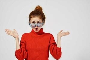 portrait of a woman fashionable blue glasses posing light background photo